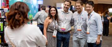 IAAPA Latin America Summit attendees pose for a photo while shopping for new products and services